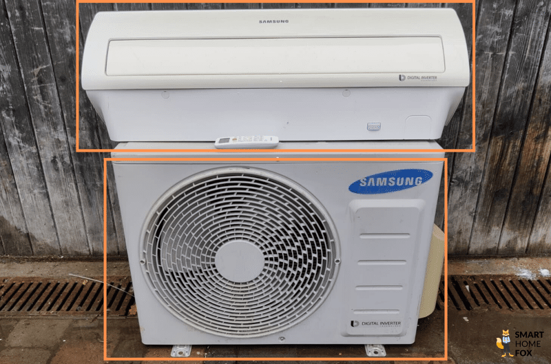 Samsung Split Klimagerät Außeneinheit steht auf dem Boden und Inneneinheit liegt drauf.